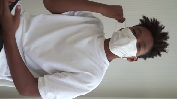 Vertical Video of African Teenager Showing COVID19 Vaccine Bandage Merrily alt