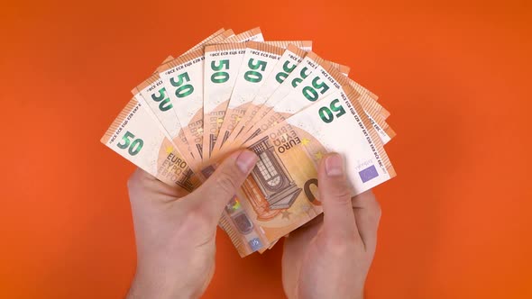 Bunch Of Euro Banknotes In Hands