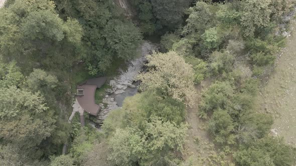 Aerial view of Martvili canyon. Blue water in fresh cold mountain river at sunny summer morning alt