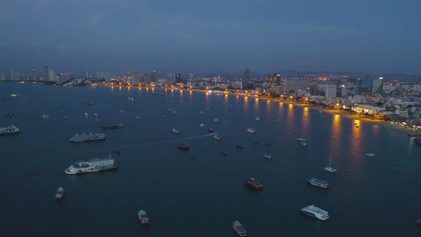 Aerial view of boats in Pattaya sea, beach in Thailand in summer season, with sunset sky alt