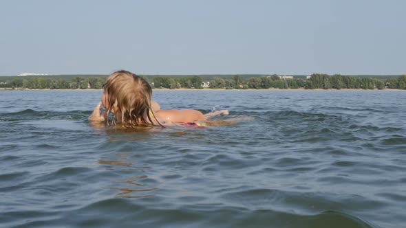 Teenagers Boy and Girl of School Age Bathe in the River alt