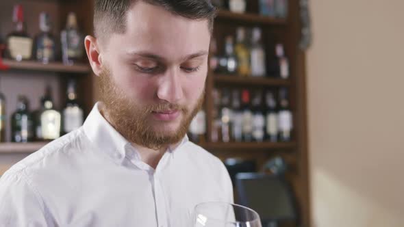 Sommelier Tating the Wine Slow Motion alt