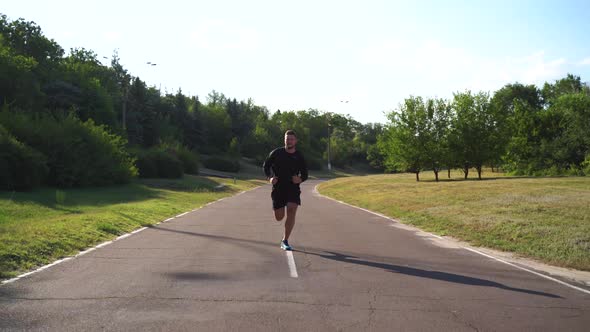 Tracking Shot of Sportsman Jog Cardio WorkoutTrainer Fitness Hard ...