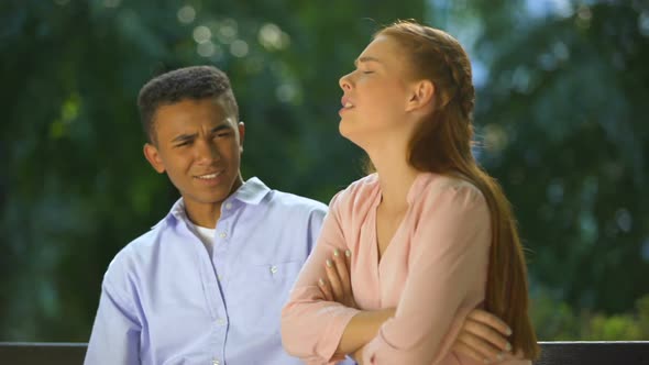 Offended Girl Sitting With Folded Hands, Boy Shocked With Her Whims, Conflict alt