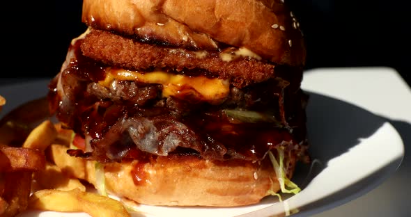 Great Burger with beef cutlet, tomatoes and cucumbers with melted cheese. alt