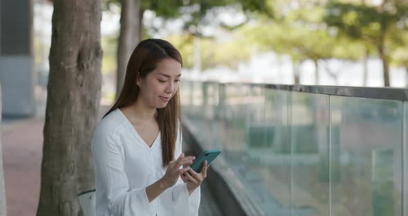 Woman Use of Smart Phone at Outdoor
