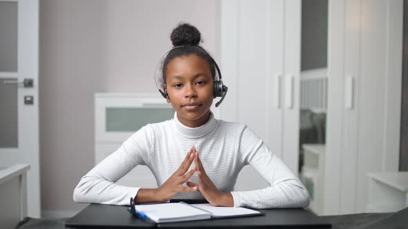 Distance Learning and Homeschooling Online African Teen Girl Uses a Video Call and Webcam to alt