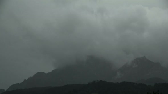 Time Lapse Thunder Clouds Moving Above Mountain Pilatus in Switzerland alt