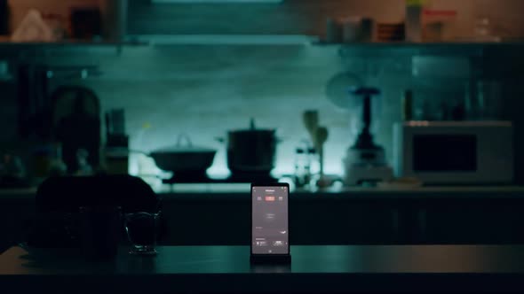 Phone with Intelligent Software Placed on Table in Kitchen with Nobody in alt