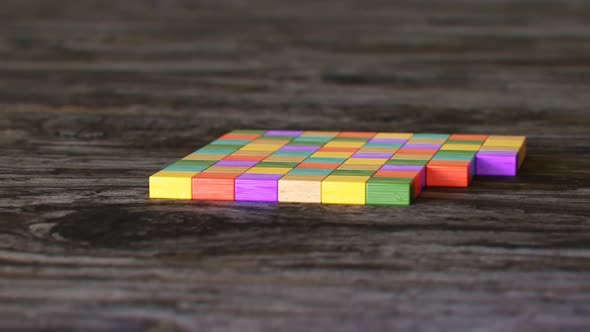 Toy house being built out of wooden blocks timelapse. Construction development. alt