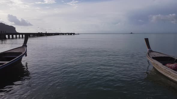 Aerial view from drones of fishing boats in the shore during low tide. alt
