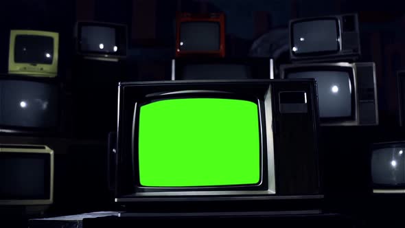 Vintage TV with Green Screen and a Retro TV Stack Installation. Blue Tone. alt