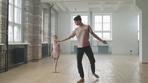 Ballet Trainer And Little Student Dancing Together alt