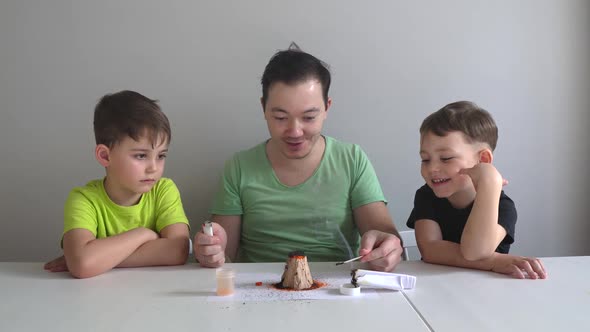 Dad and Sons Making Chemical Experiments
