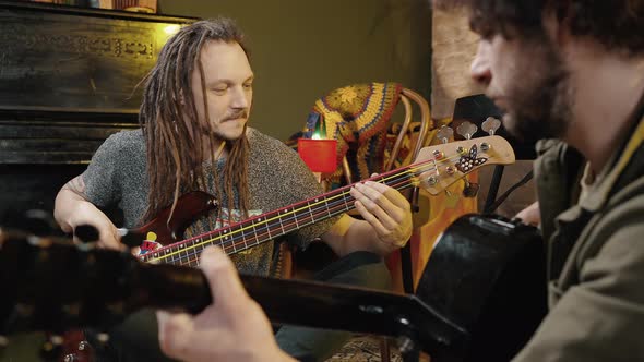Two Happy Men Musicians Creating Cool Music Together Playing Guitars Rehearsing at Studio alt