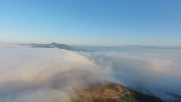 Mountain landscape in clouds, bend of the road in Malibu Canyon, Monte Nido, California, USA alt
