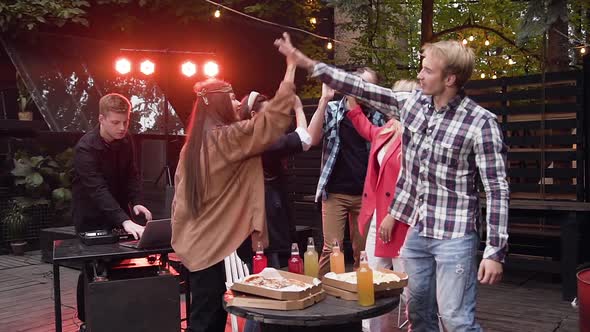 Joyful Young Caucasian Friends Giving High Five, Together Celebrating on Party alt