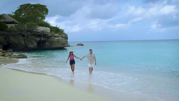 Couple Men and Woman Mid Age on the Beach of Curacao Grote Knip Beach Curacao Dutch Antilles alt