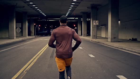 Athletic Male Running Through A Tunnel alt