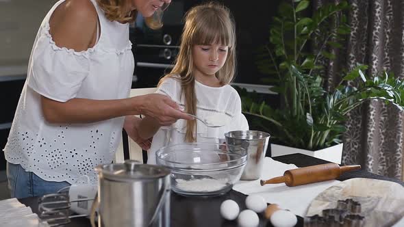 Attractive Young Mother Preparing Everything for Cooking alt