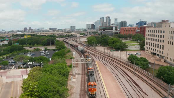 Aerial View of Cargo Train Slowly Riding Through EBJ Union Station alt