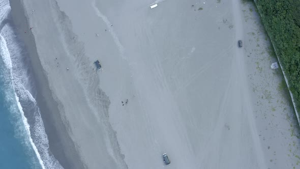 Aerial Top Down Birds Eye View of Road Next to Beach alt