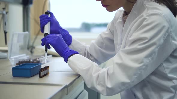 Woman Chemist Uses Pipette with Liquid Filling Pcr Test Tubes Spbd alt