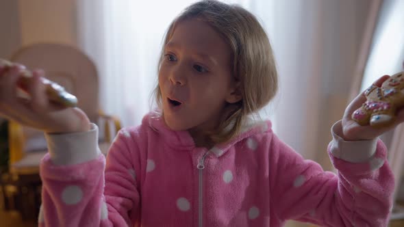 Front View Excited Cute Girl Boasting Gingerbread Cookies Looking at Camera alt