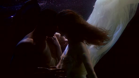 Passionate and Sensual Embrace of Loving Pair Underwater, Man and Woman Are Caressing alt