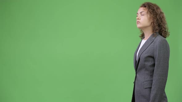 Profile View of Young Beautiful Businesswoman with Curly Blond Hair alt