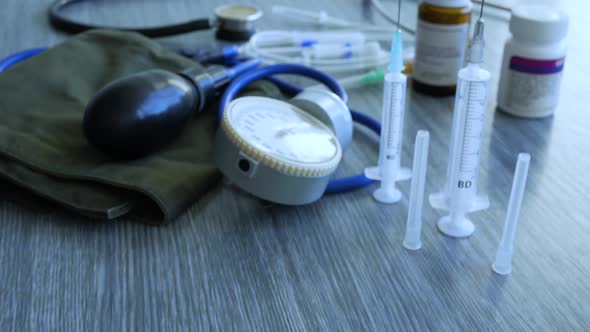 Tonometer Syringes And Pills alt