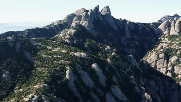 Drone flight over the famous mountain range of Catalonia; sunny winter
