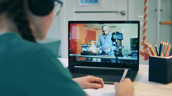 Laptop Display During Online Robotics Class Taught To a Girl alt