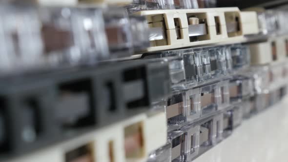 Shallow DOF  retro data  analogue magnetic tapes stacked  4K 2160p 30fps UltraHD tilting footage - C alt