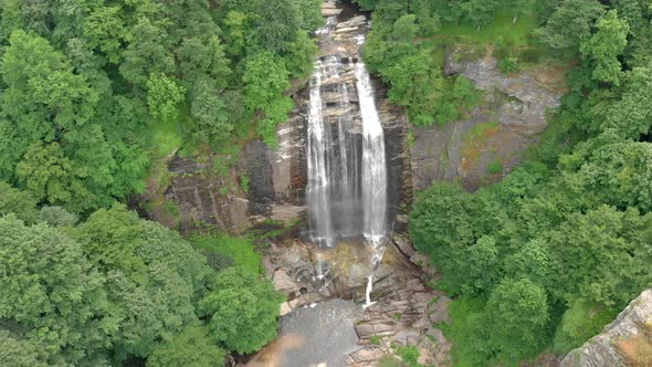 Aerial Large Waterfall in Untouched Wild Forest alt