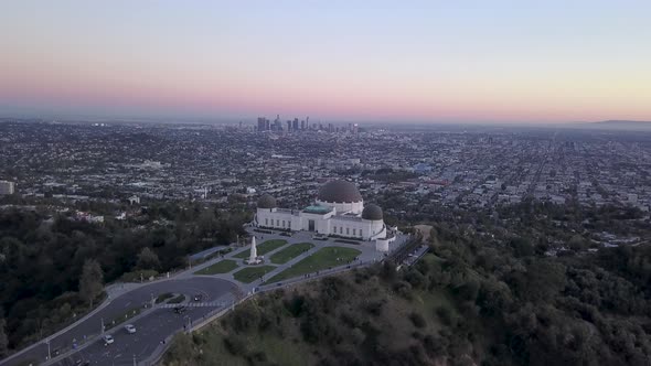 Griffith Observatory and the Los Angeles city skyline seen in the distance from above. alt