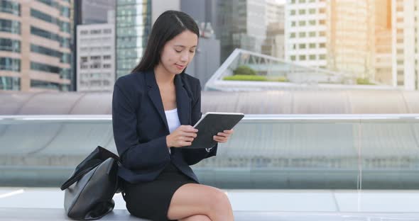 Businesswoman working on tablet computer  alt