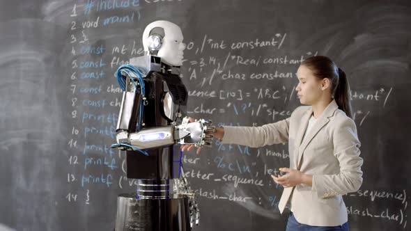 Girl And Android Shaking Hands alt