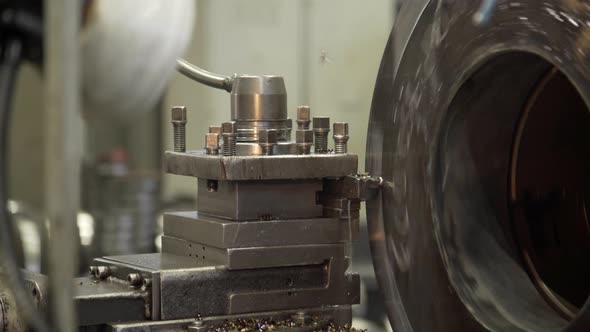 Turning Lathe in Action. Facing Operation of Metal Blank on Turning Machine with Cutting Tool. Old alt