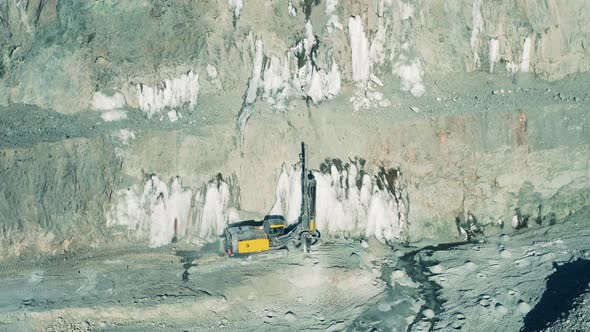 Top View of a Drilling Machine Working in the Openpit Mine alt
