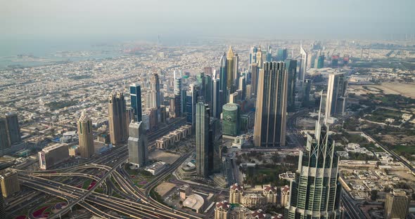 Panoramic view of Dubai skyline from Burj Khalifa tower skyscraper. Time lapse alt