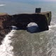 Lava arch at Dyrholaey peninsula next to Reynisfjara beach in Iceland - VideoHive Item for Sale