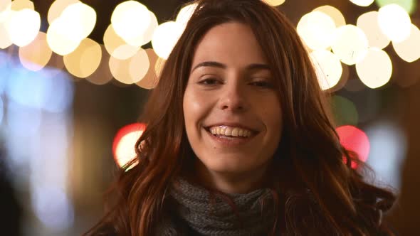 Baeutiful Caucasian Brunette Younf Female Smiling Looking at Camera Waiting Rubbing Her Hands in alt