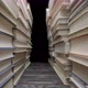 Camera Pans Between Stacks of Old Books with Gray Shabby Covers - VideoHive Item for Sale