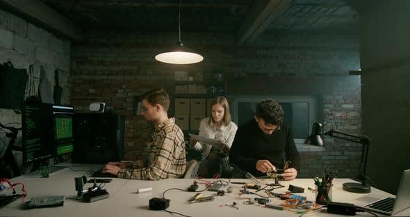 Hero Shot of Team Working on Technology Electronics Startup in Loft Office alt