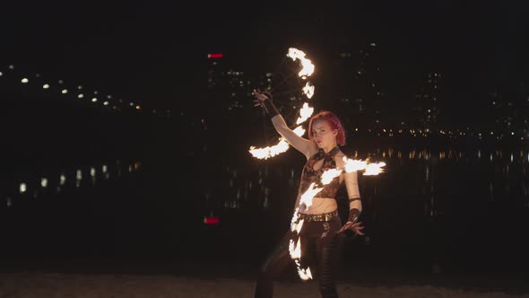 Female Dancing with Flaming Fans During Firshow alt