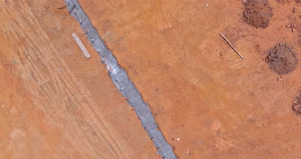 Strip Foundation Reinforcement Frame for a Reinforced Concrete House Structure in Construction Site alt