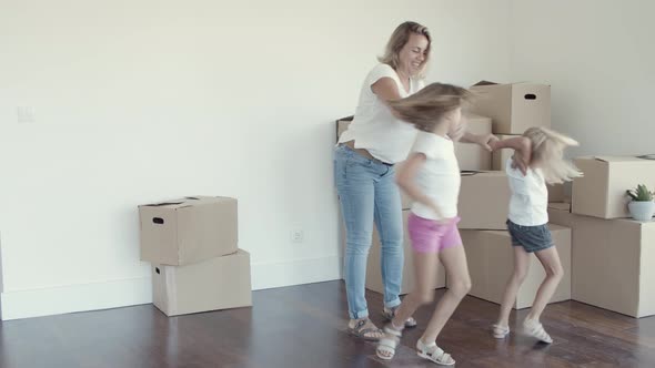 Happy Mom Dancing with Daughters alt