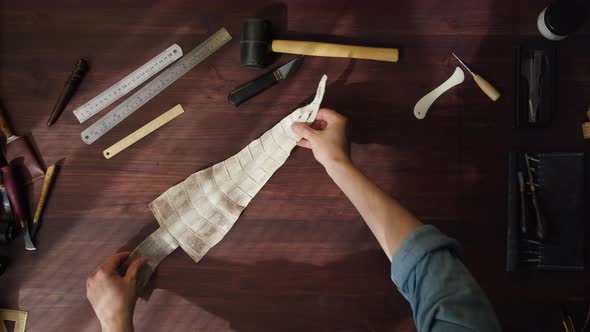 Putting Colored Python Leather on Table Preparing Materials and Tools Before Working at alt