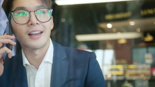 Smart positive smile asian male businessman video conference alt